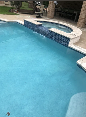 Pool with freshly resurfaced white concrete deck
